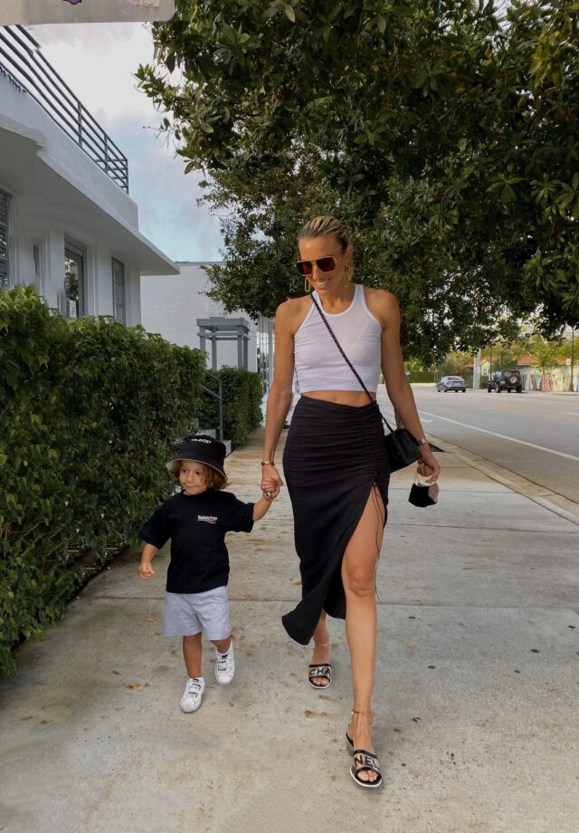 natalie rolt skirt, miami style, kids balenciaga, kids balenciaga t-shirt, kids golden goose, kids molo bucket hat, the perfect white tank, bottega veneta navigator sunglasses, bottega veneta bag, chanel sandals, the accessory junkie jewelry, trendy kids apparel, trendy toddlers, toddler style inspo, mom and toddler fashion inspo