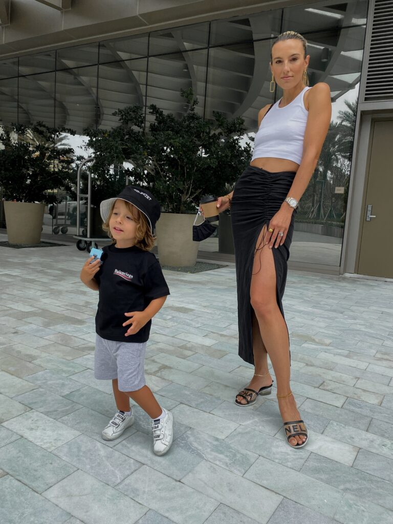 melijoe, melijoe kids style, natalie rolt skirt, miami style, kids balenciaga, kids balenciaga t-shirt, kids golden goose, kids molo bucket hat, the perfect white tank, bottega veneta navigator sunglasses, bottega veneta bag, chanel sandals, the accessory junkie jewelry, trendy kids apparel, trendy toddlers, toddler style inspo, mom and toddler fashion inspo
