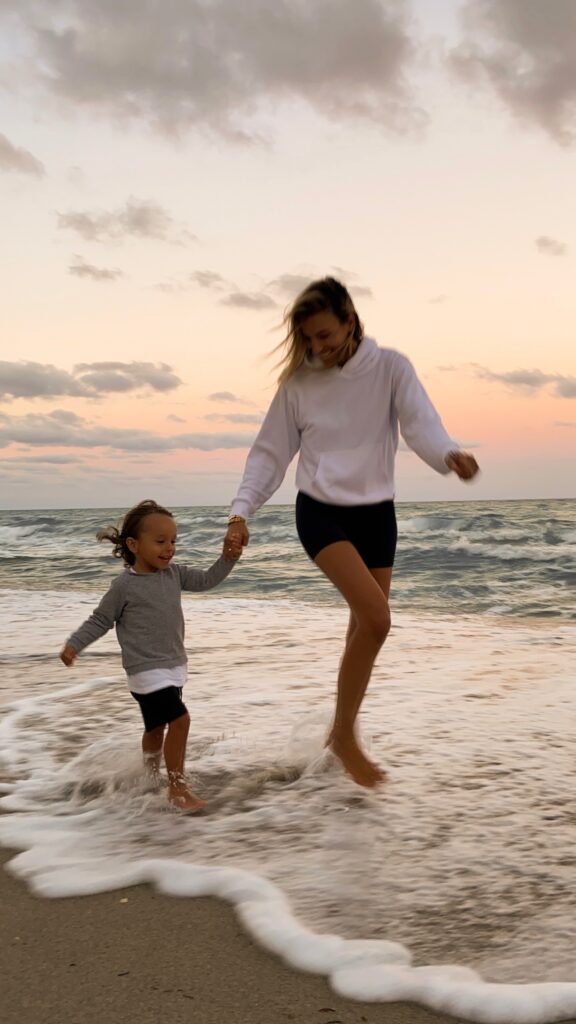 white hoodie, aritzia loungewear, aritzia hoodie, miami sunset, miami photoshoot, family photoshoot, mommy blogger, free people bike shorts, black bike shorts, trendy toddler, toddler style inspo