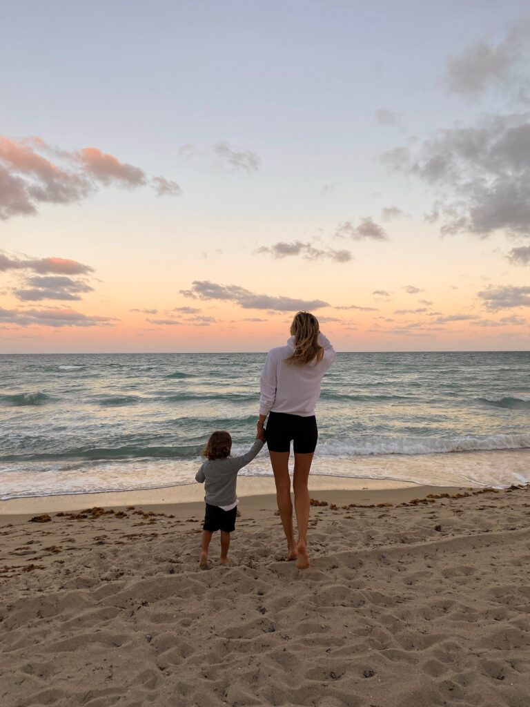 white hoodie, aritzia loungewear, aritzia hoodie, miami sunset, miami photoshoot, family photoshoot, mommy blogger, free people bike shorts, black bike shorts, trendy toddler, toddler style inspo