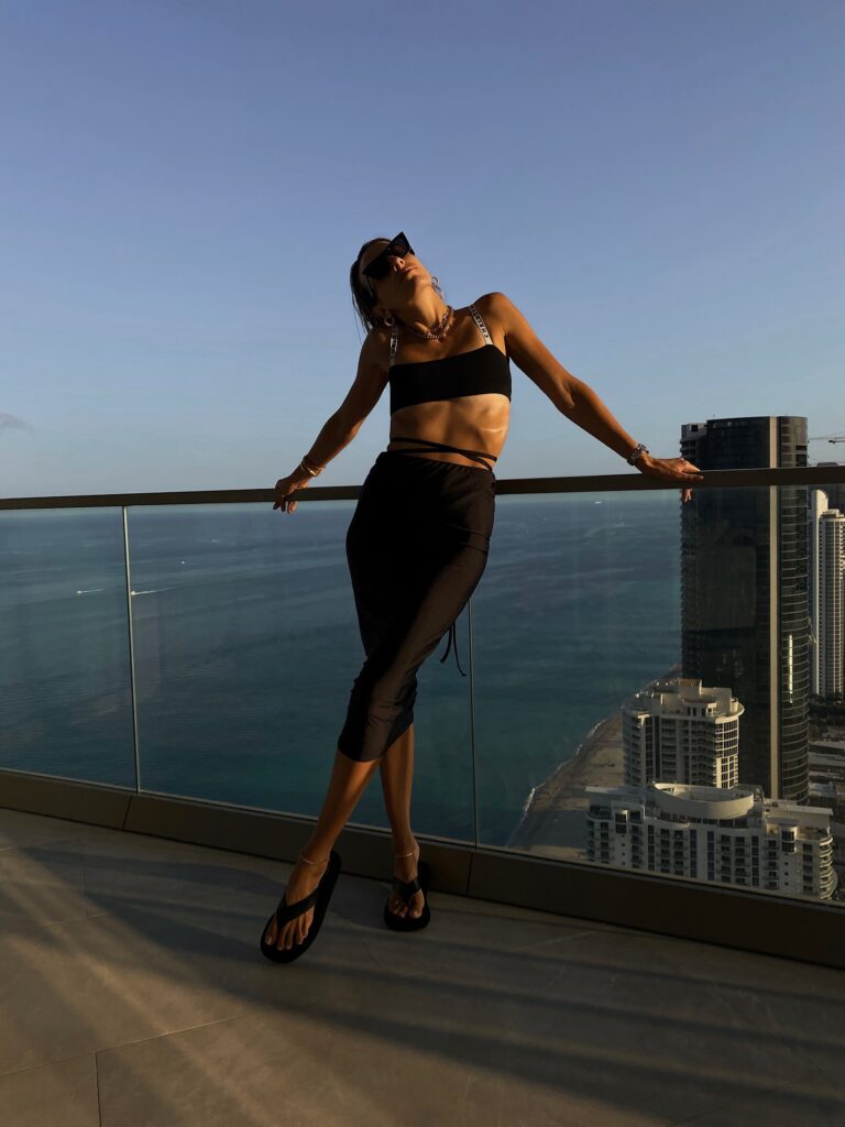 revolve, #revolveme, electric picks jewelry, gold jewelry, dior bralette, afrm skirt, wrap skirt, black afrm skirt, midi skirt, the row sandals, old celine sunnies, balcony photo, miami blogger, fashion blogger, miami style inspo