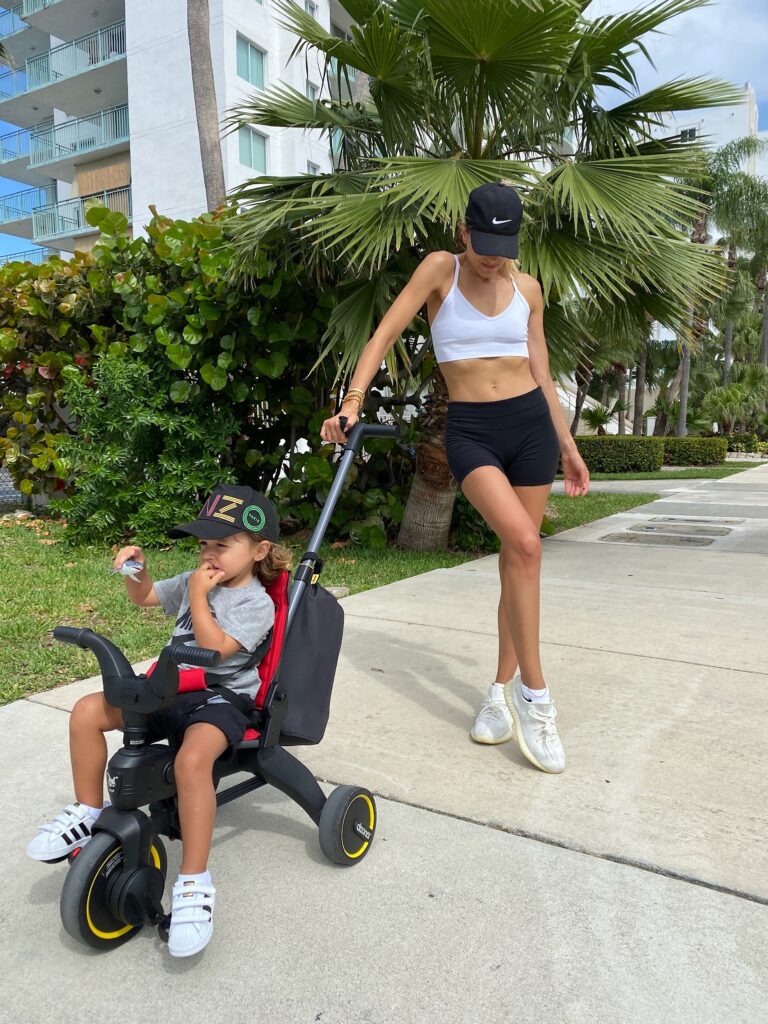 activewear inspo, mom on the go style inspo, workout in style, doona liki trike, doona bike, womens nike hat, yeezy womens style, kenzo kids hat, adidas toddler sneakers