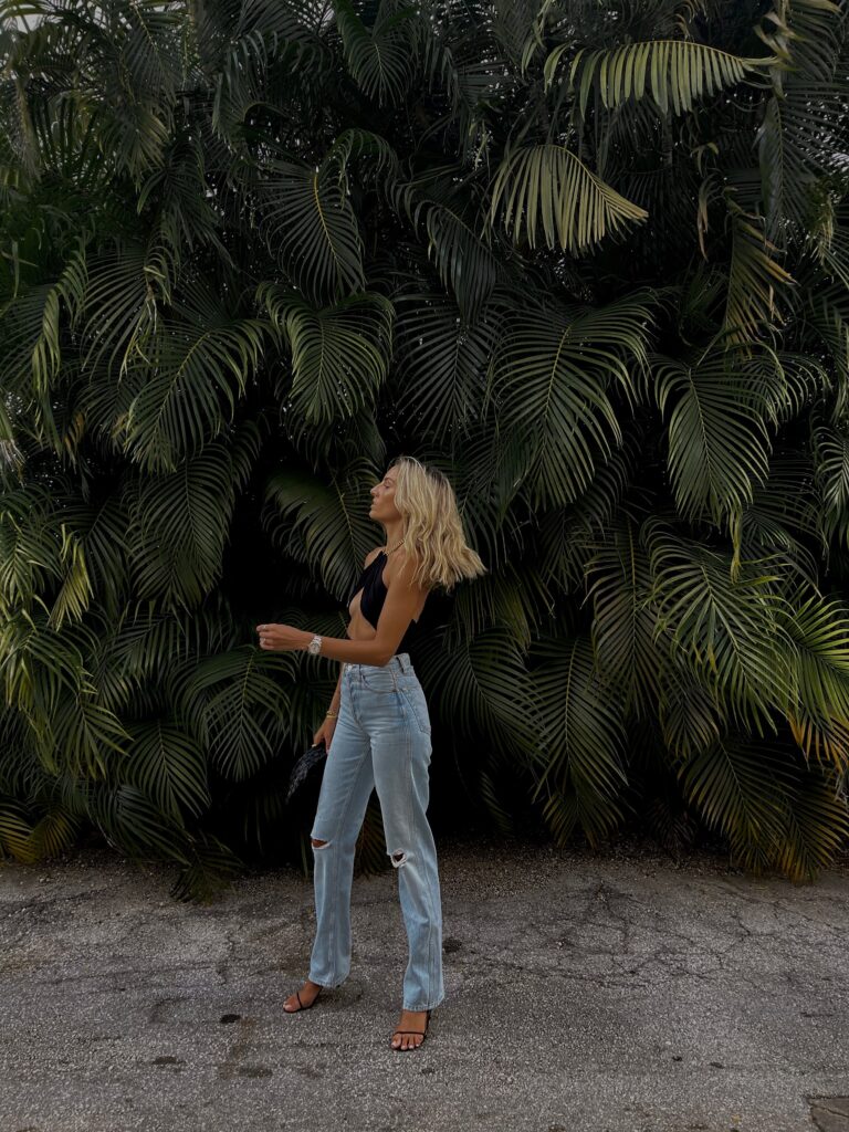 past midnight top, chain halter top, wrap top, best selling jeans, redone jeans, high rise 90s loose jeans, the row heel, miami style inspo, beach vacation inspo