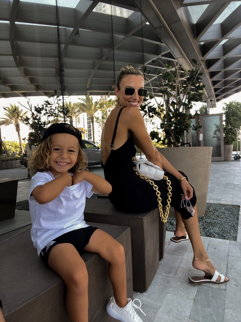 glassons, glassons dress, black knit mini dress, miami style inspo, hermes sandals, celine sunnies, bottega veneta bag, toddler style inspo