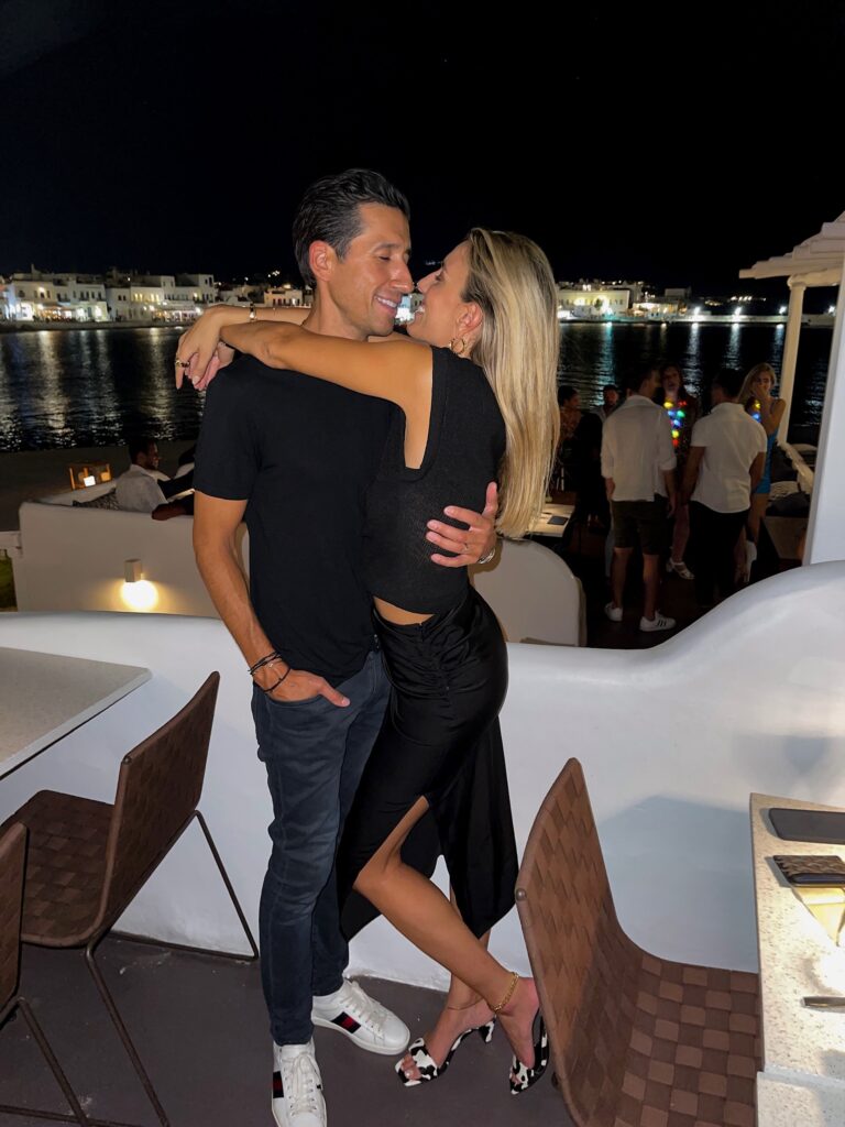 jacquemus twist knot top, bottega veneta pink clutch, bottega veneta mini clutch, h:ours midi skirt, black midi skirt, electric picks, date night outfit, song of style heel, black and white heel, revolve look