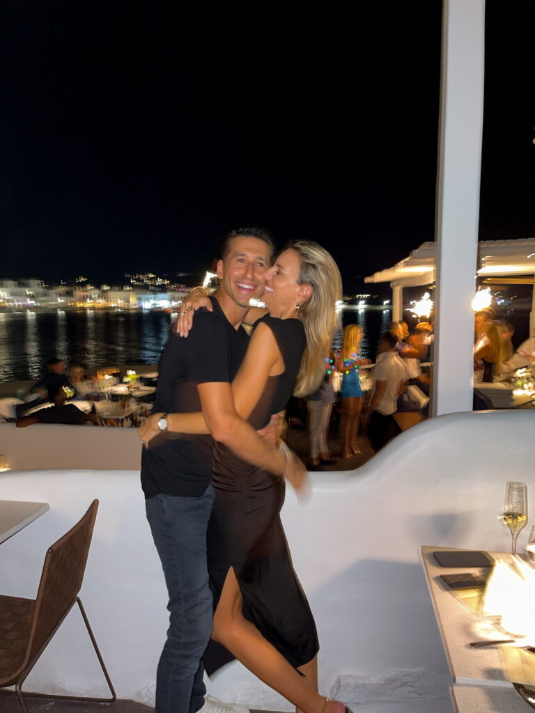 jacquemus twist knot top, bottega veneta pink clutch, bottega veneta mini clutch, h:ours midi skirt, black midi skirt, electric picks, date night outfit, song of style heel, black and white heel, revolve look