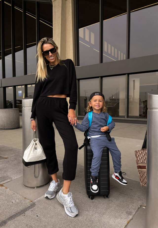 monrow, monrow black womens loungewear set, black loungewear set, new balance sneakers, bottega veneta sunglases, chanel backpack, miles baby loungwear set, toddler loungewear set, air jordan toddler sneakers, airport look, family travel inspo
