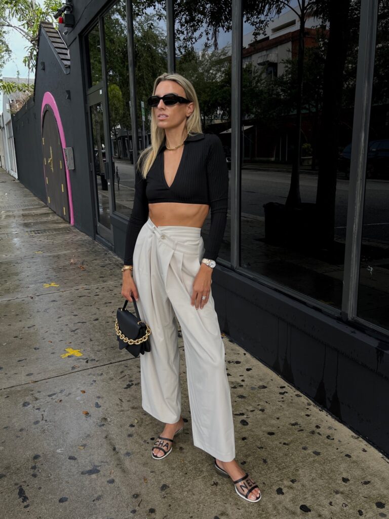 the source unknown trousers, camel trousers, revolve ambassador, revolve black cropped top, chanel sandals, prada sunglasses, sunglass hut, bottega veneta envelope bag, neiman marcus designer bag