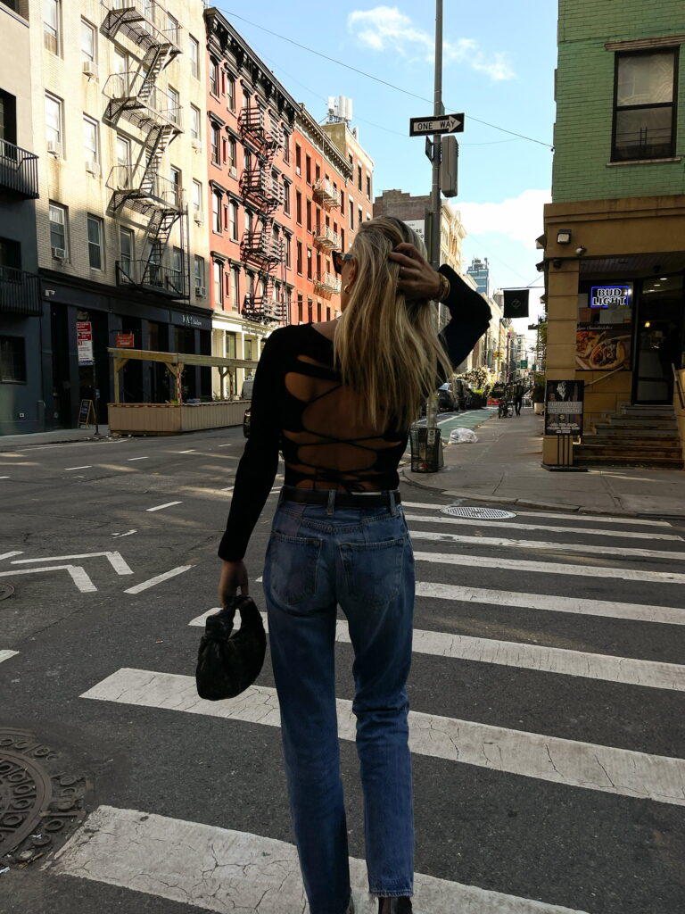 khaite top, khaite, black strappy top, redone jeans, bottega veneta jodie bag, street style