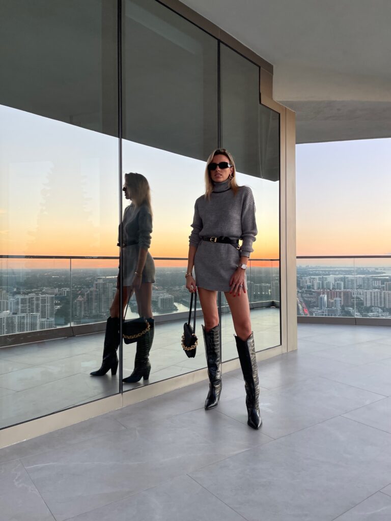 lovers + friends, ,lovers and friends, grey sweater dress, revolve ambassador, revolve sweater dress, khaite belt, prada sunnies, bottega veneta envelope shoulder bag, croc embossed boots