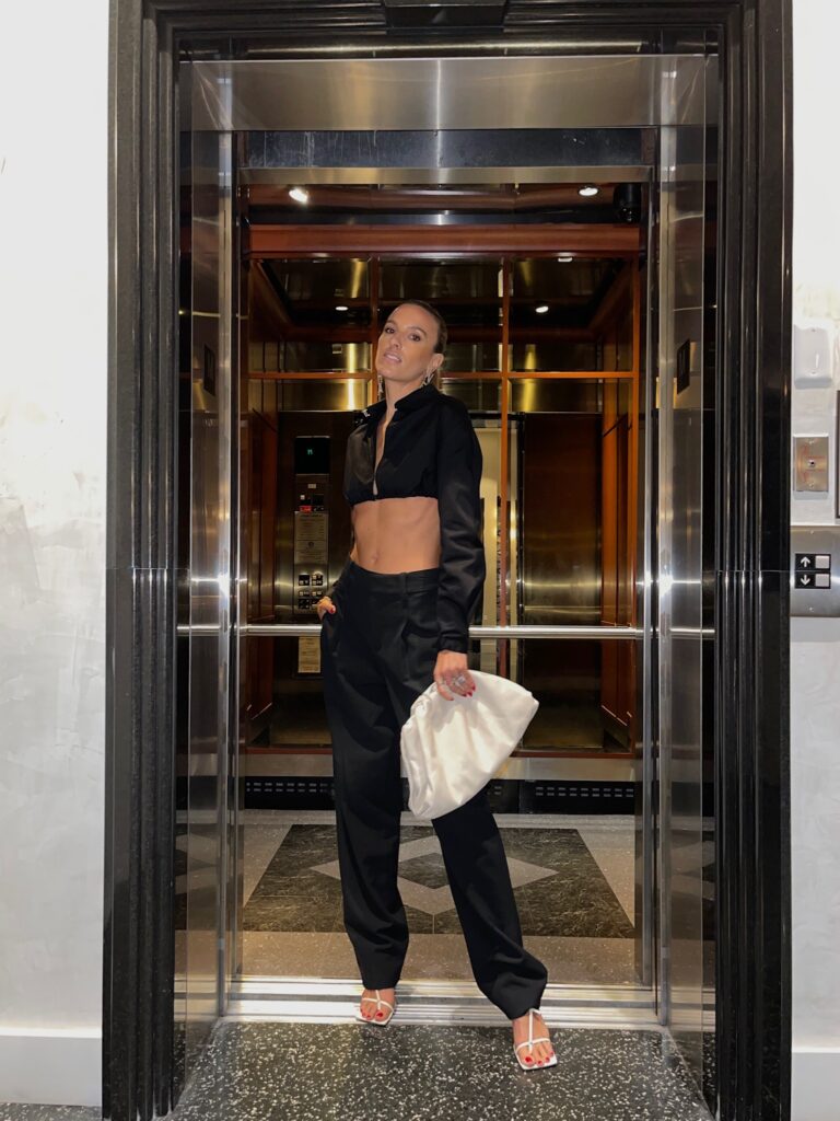 dion lee top, alc trouser, alc pant, bottega veneta clutch, bottega veneta stretch sandals, art basel 2021, art basel outfits, chanel earrings, black trouser